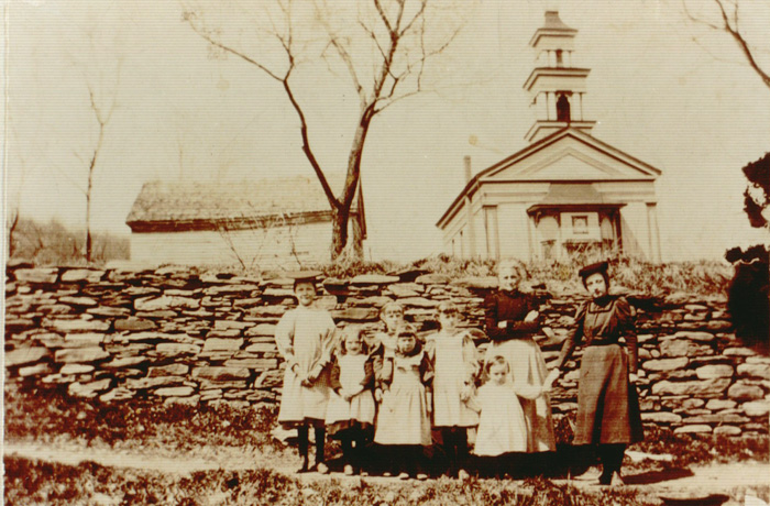Old Group Picture taken in front of church at Bloomville