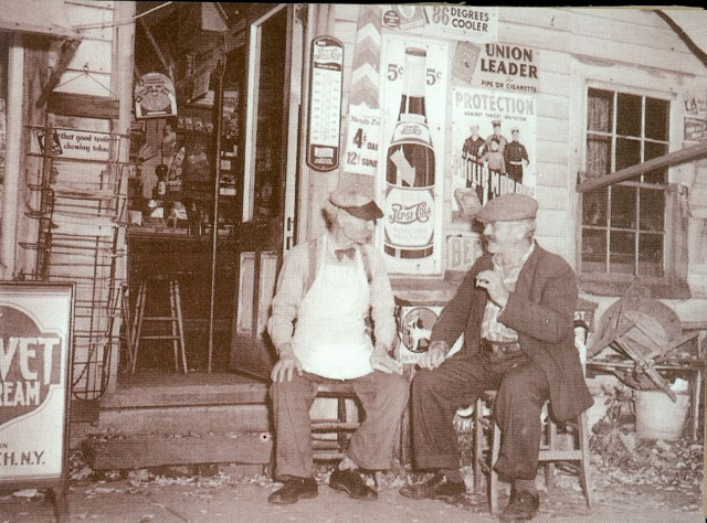 Fred Cuyle and friend in from of store