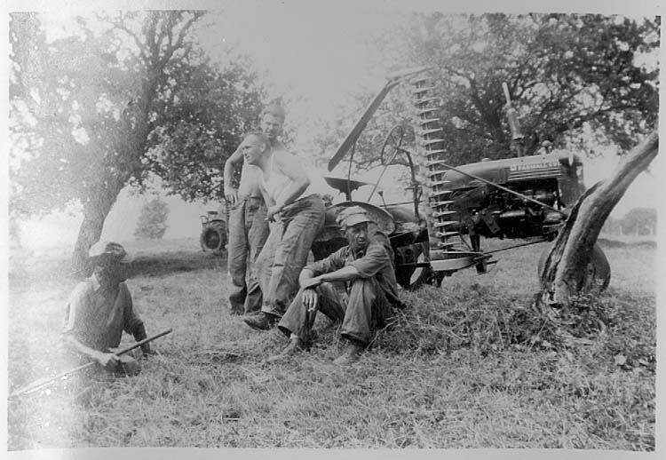 Men by mowing machine - Aug 1952