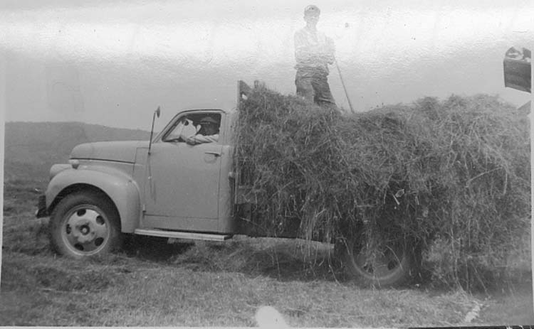 Melvin McAdams on truck - Aug 1952